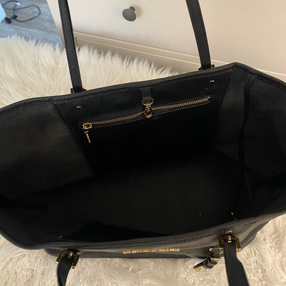 Black leather Michael Kors tote bag with gold-toned accents and flat handles. - Picture 8 of 12
